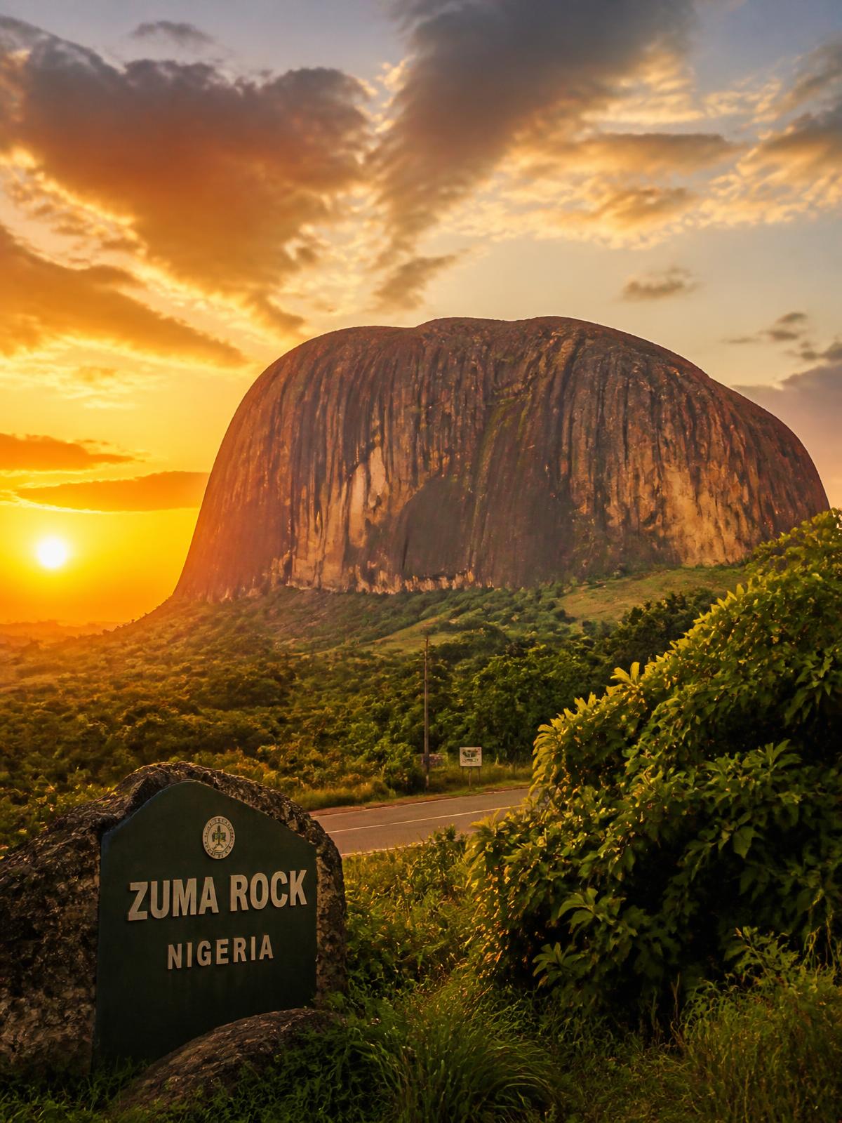 Zuma Rock in Nigeria at sunset with lush greenery
